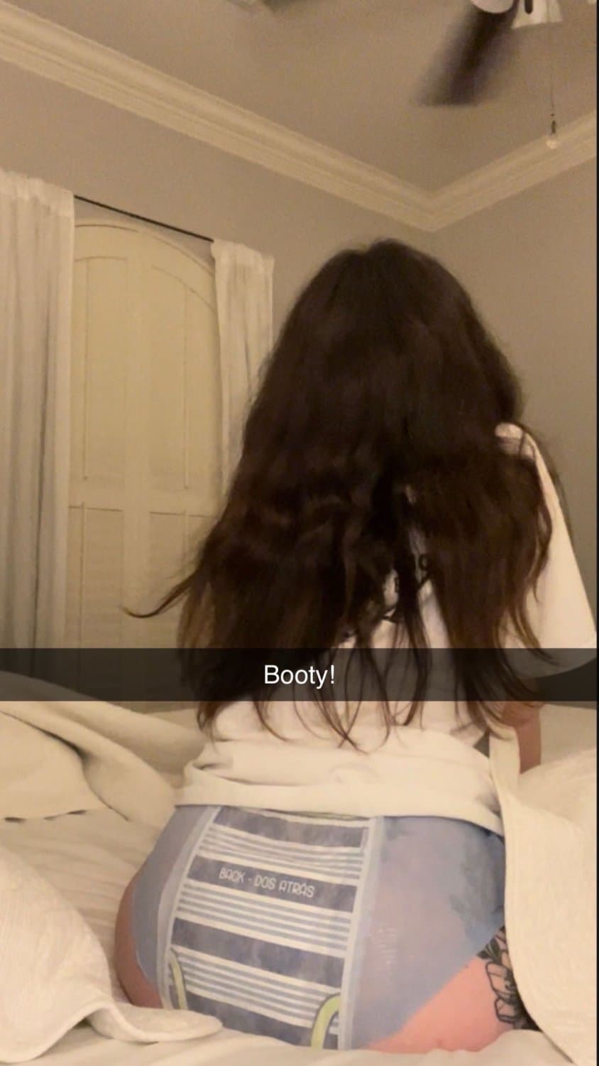 Cute tanned girl shows off her diapers and pull-ups