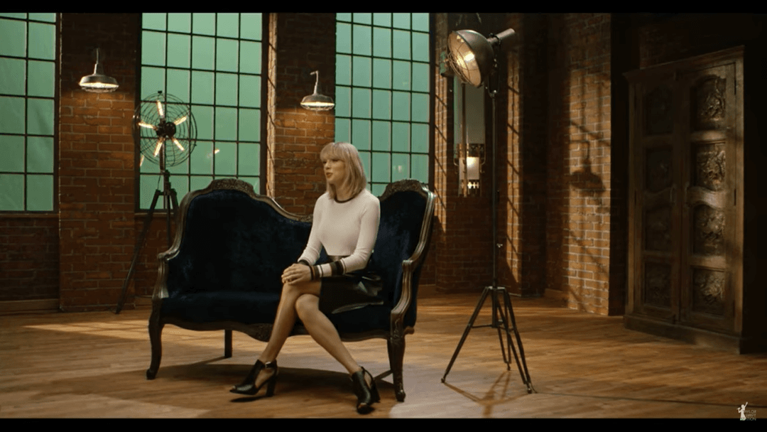 Taylor Swift tight white sweater, leather skirt, leather heels