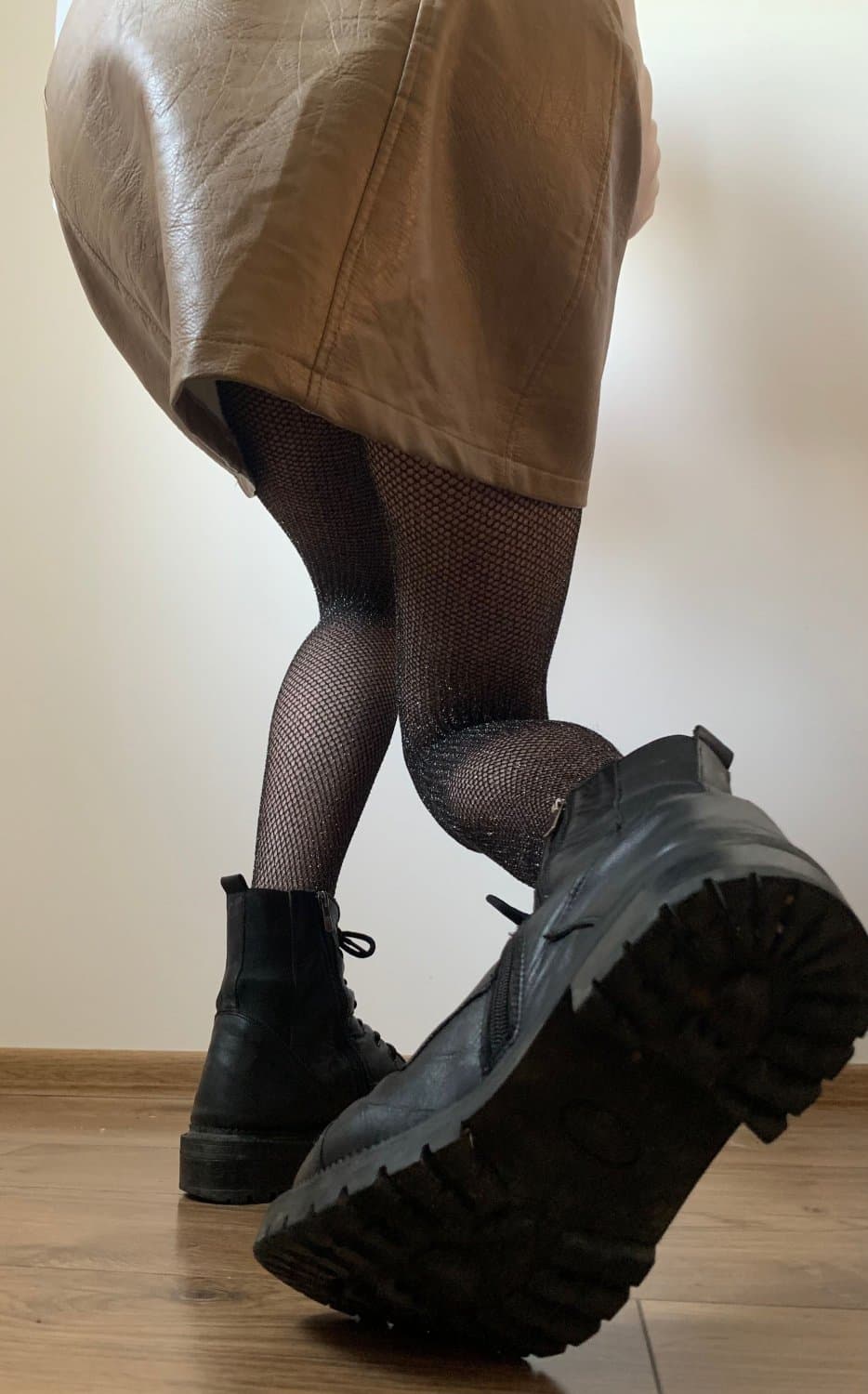 Kate Sissy Cl1412 showing her in leather skirt and fishnets