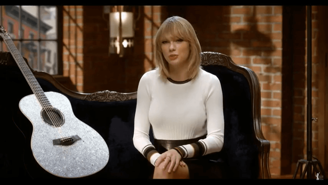 Taylor Swift tight white sweater, leather skirt, leather heels