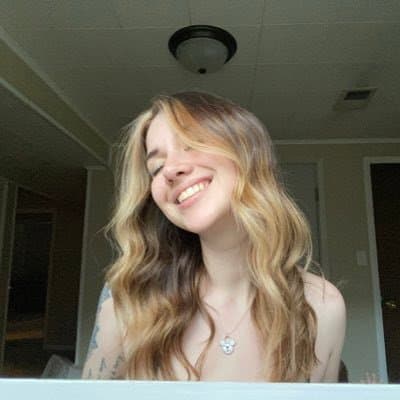 Click to view full size Hottest Milf ever? This curvy slut who loves sticking her tongue out comes damn close