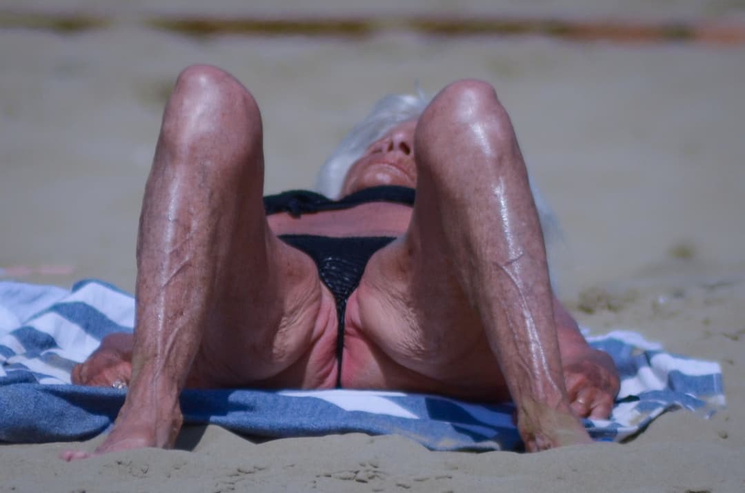 grandmother in her eighties on the beach...