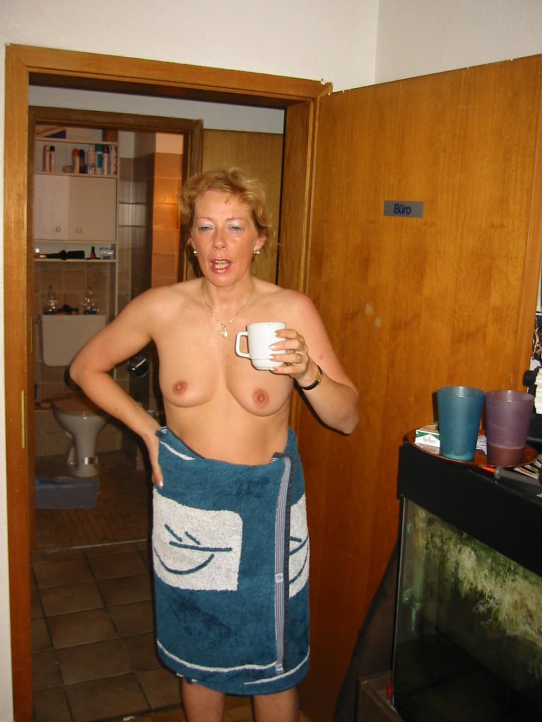 Old slut gets ready for friends in the bathroom