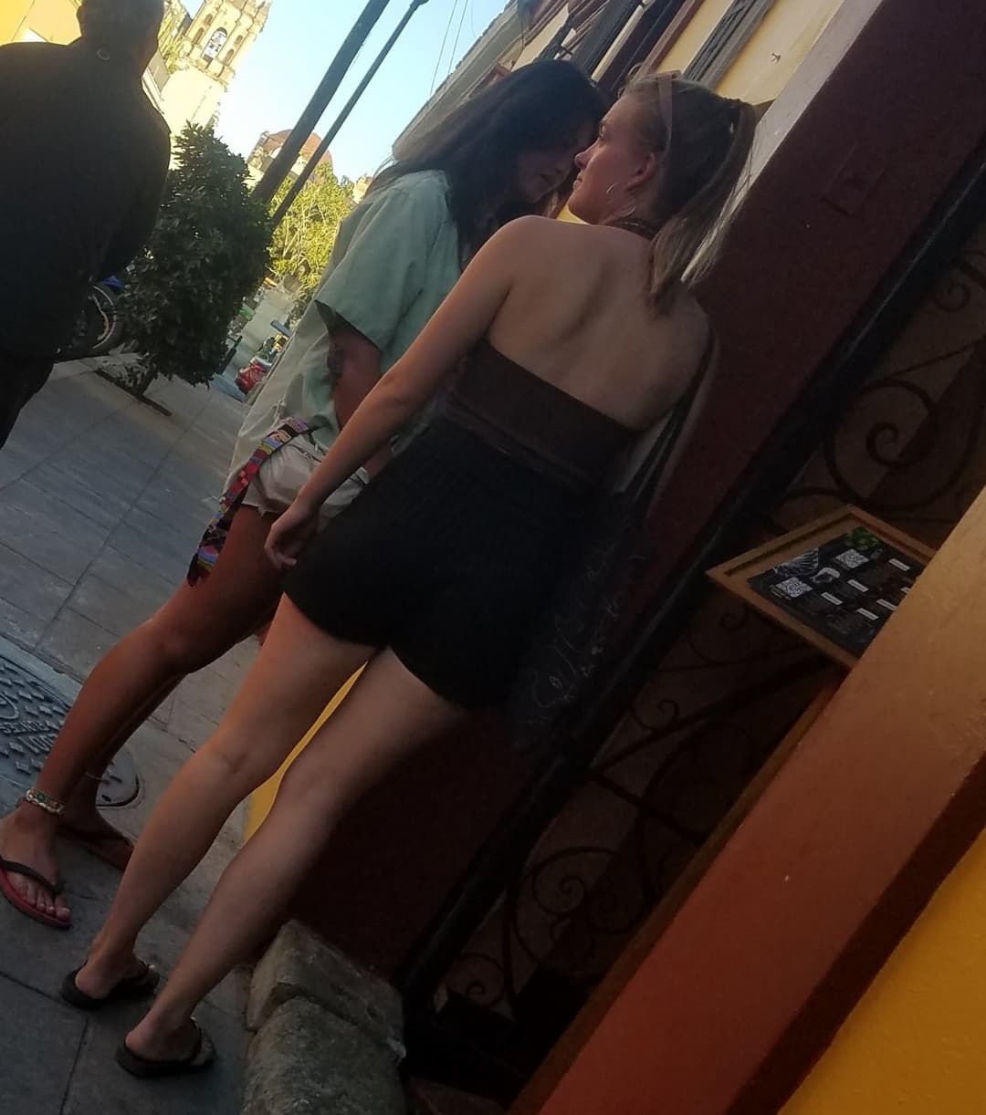 2 friends, blonde and brunette, in shorts, nice legs