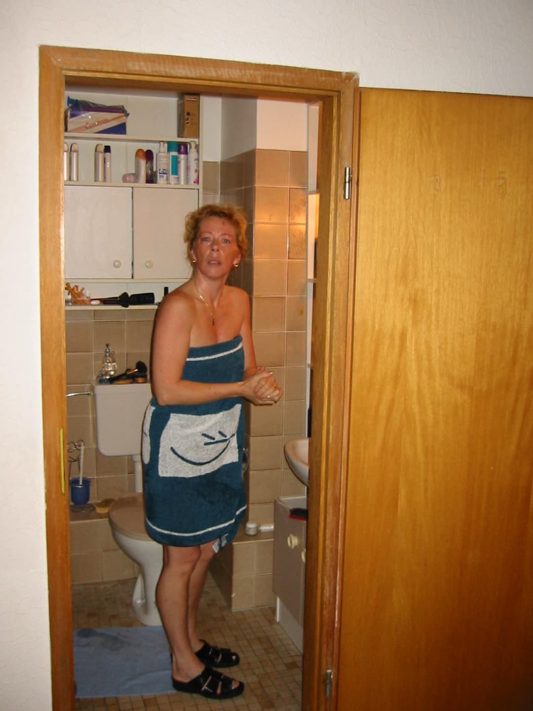 Old slut gets ready for friends in the bathroom
