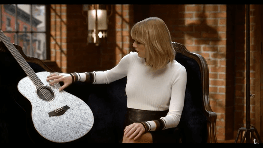 Taylor Swift tight white sweater, leather skirt, leather heels