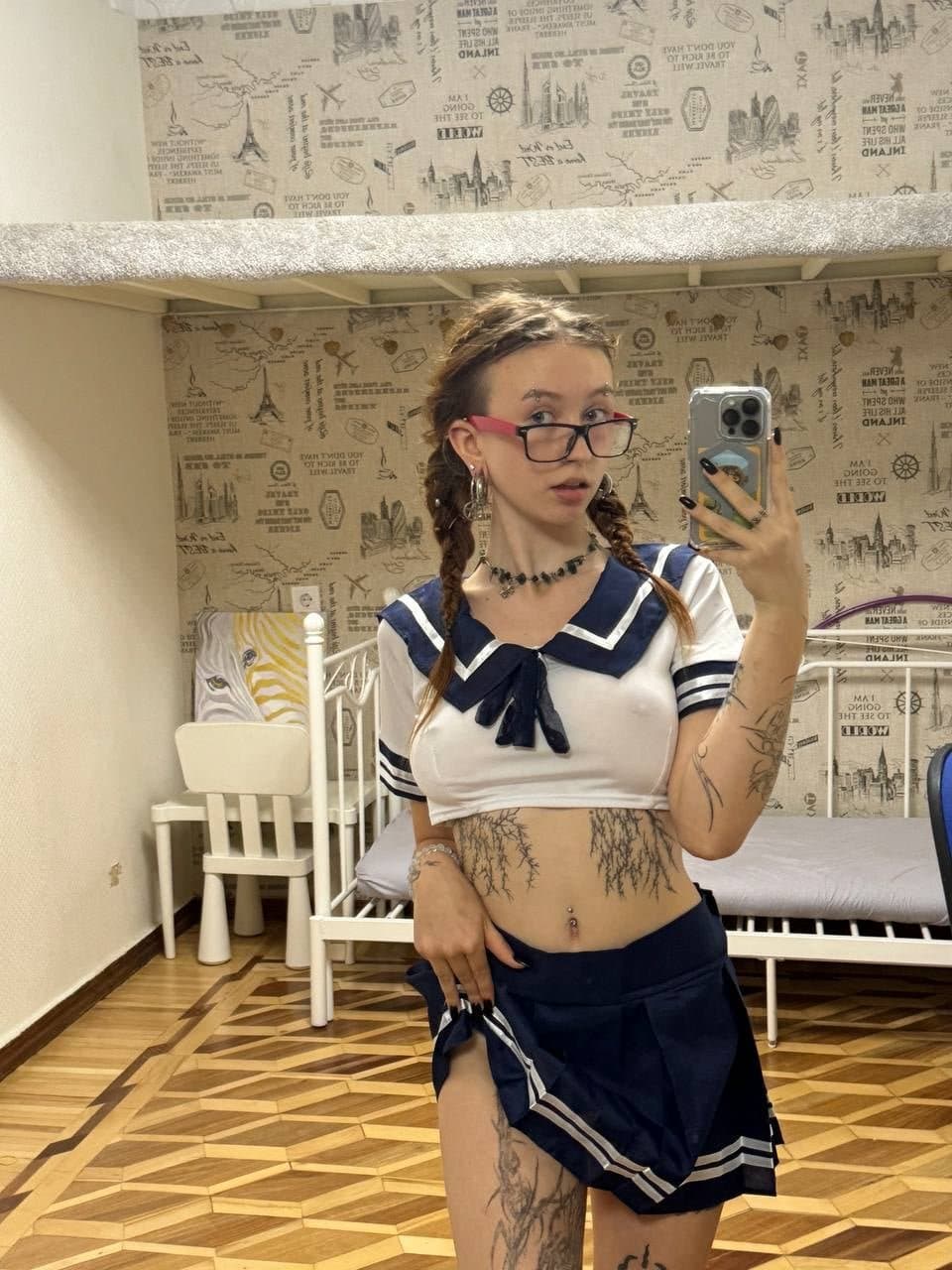 Some busty pierced braless woman ???