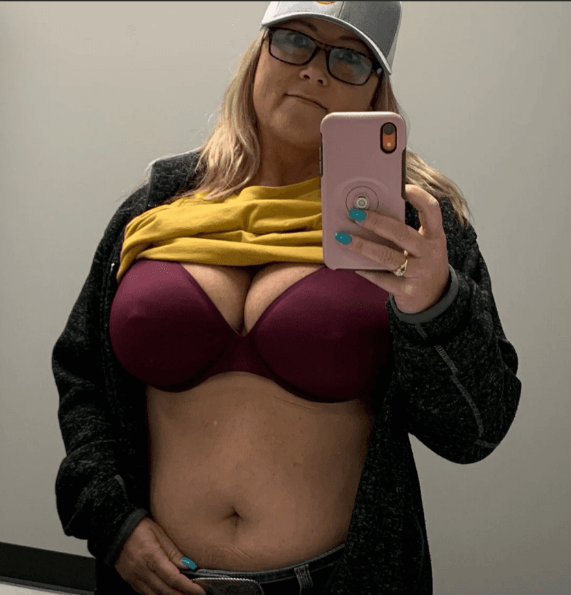 Big titted Milf showing off those pierced beauties