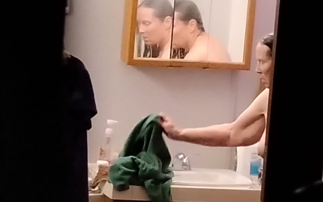 Peeking at my 60-year-old mother getting dressed after taking a shower.