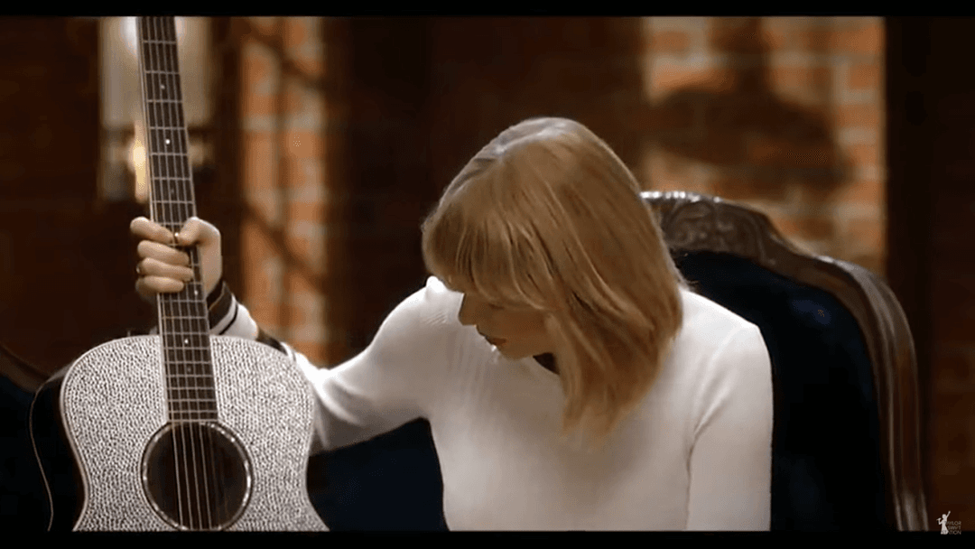 Taylor Swift tight white sweater, leather skirt, leather heels