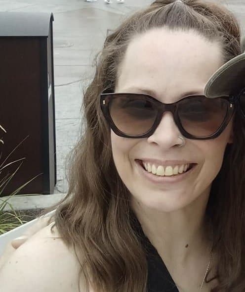 Click to view full size Tricia sneaks off to give a quick look at her titties