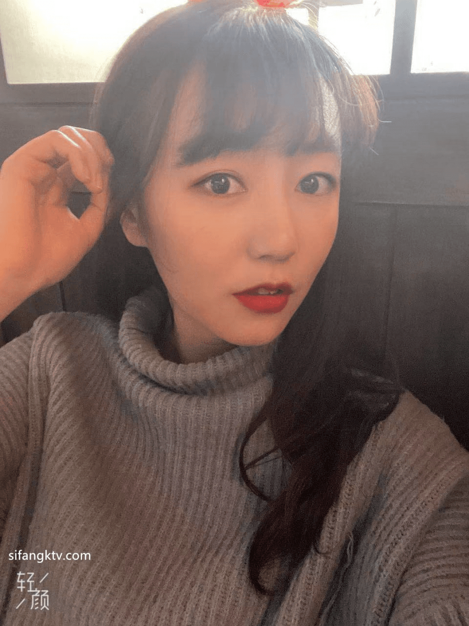 Serious looking AZN college girl behind the scene