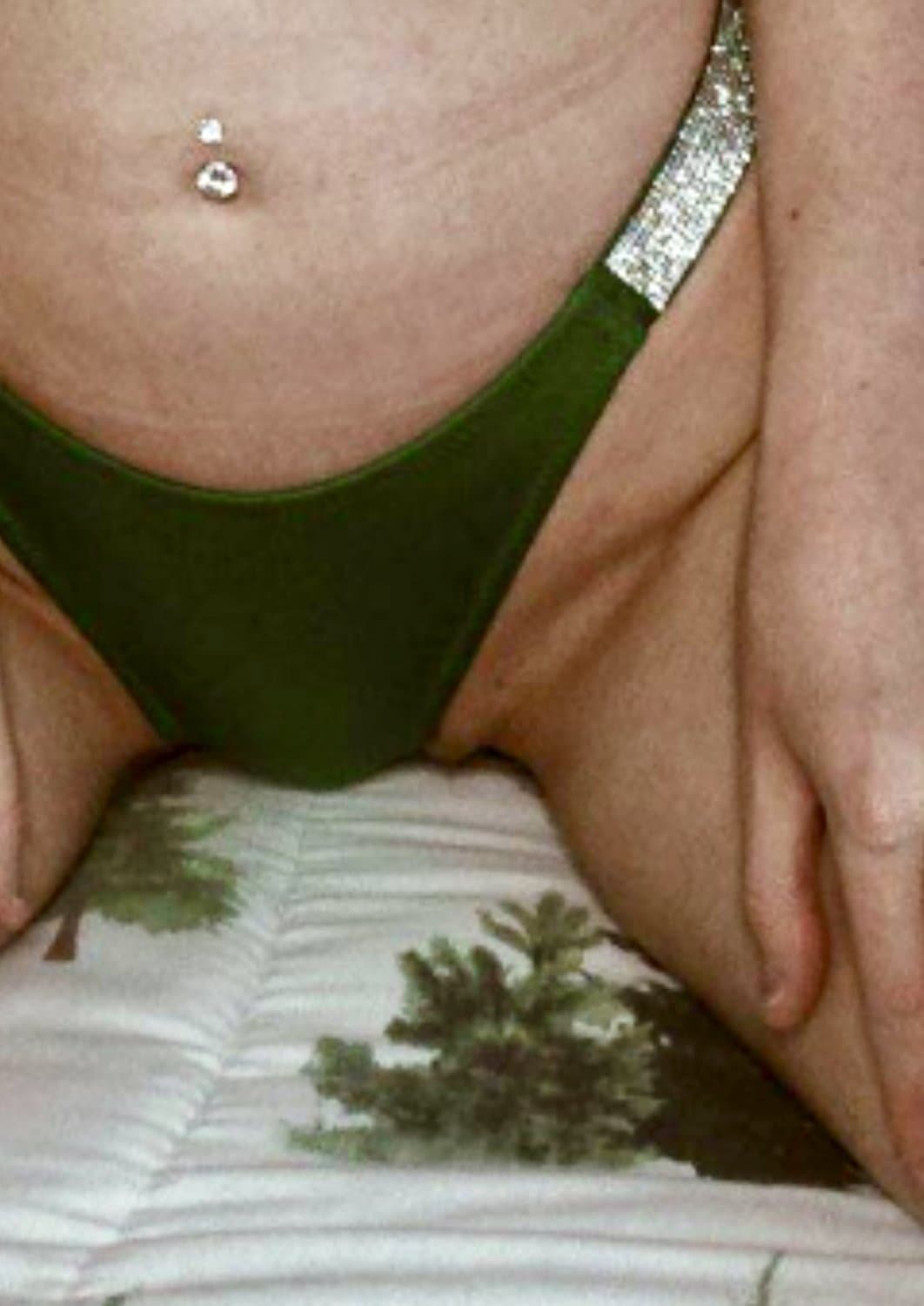 Camel toe, pussy slipping out, showing ass constantly. Made to be sexualized. What a whore
