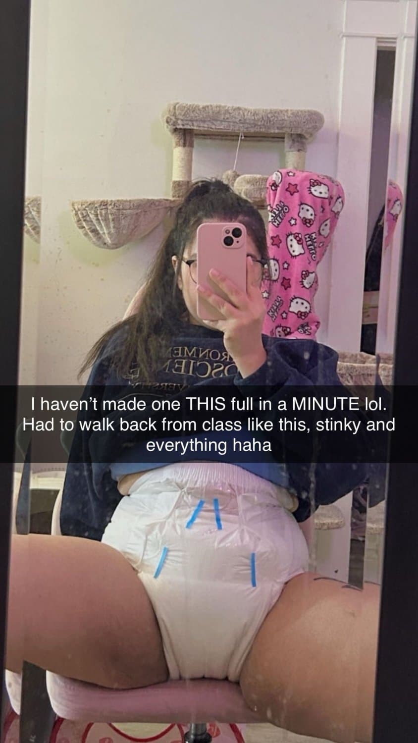 Click to view full size Incontinent college girl doesn’t mind showing off her diapers