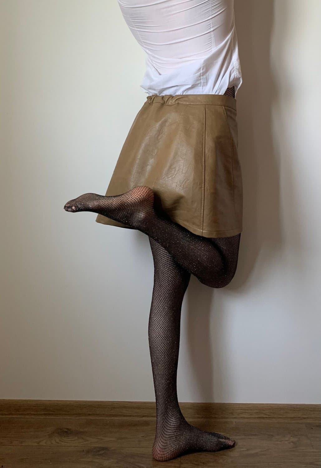 Kate Sissy Cl1412 showing her in leather skirt and fishnets