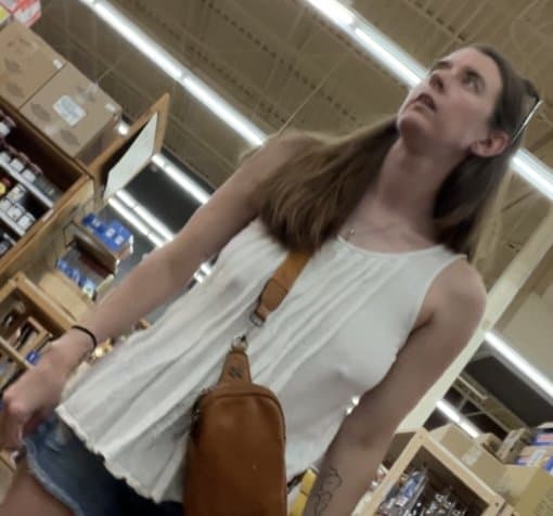 Click to view full size Bitch with no bra and big floppy tits at the store creep shots
