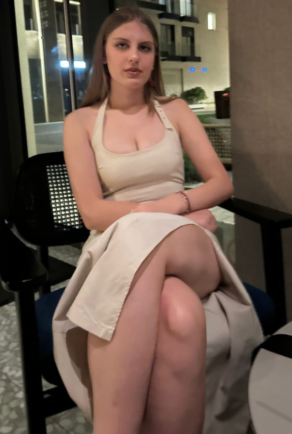 Sexy blond showing off legs and tits in tight dress