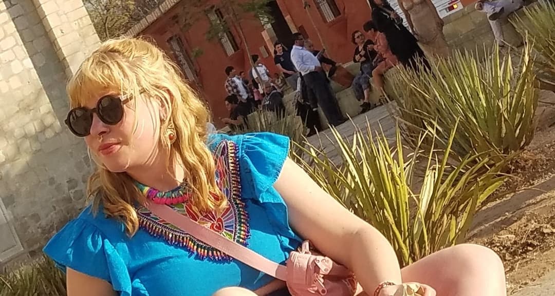 blonde sitting, legs open, nice thick legs