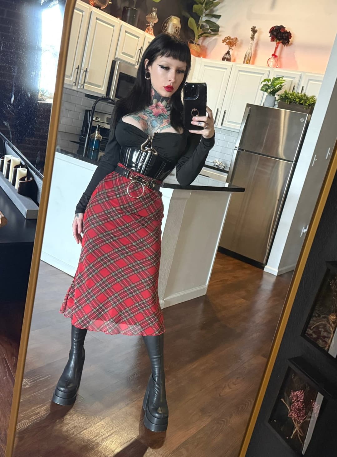 Don’t look at the skirt—look at the boots. Worship them