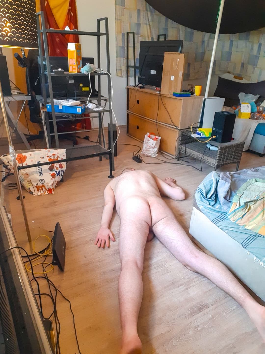 Naked male virgin beaten unconscious in front of people and filmed twitching
