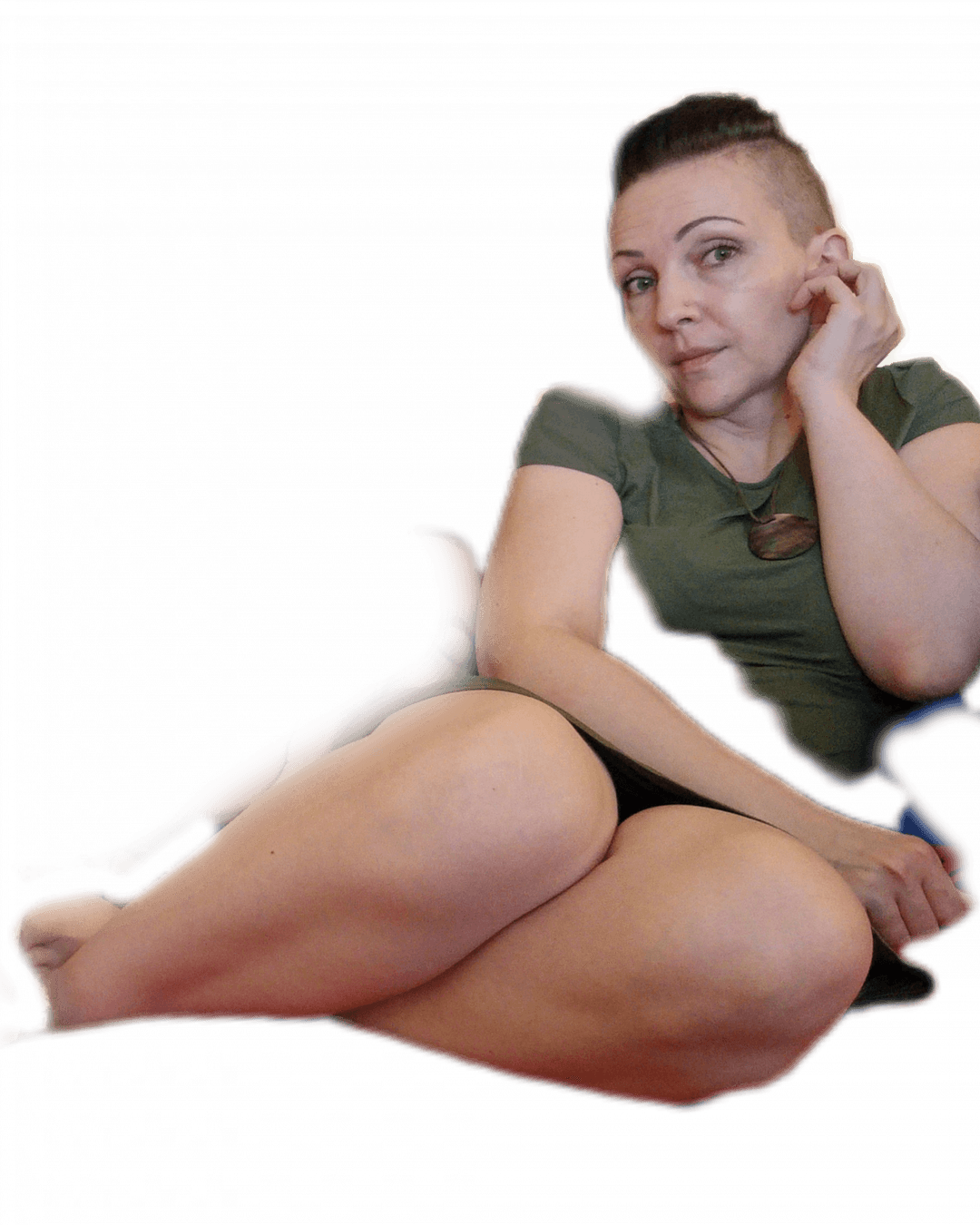 Very pretty MILF spreads her legs on the sofa.