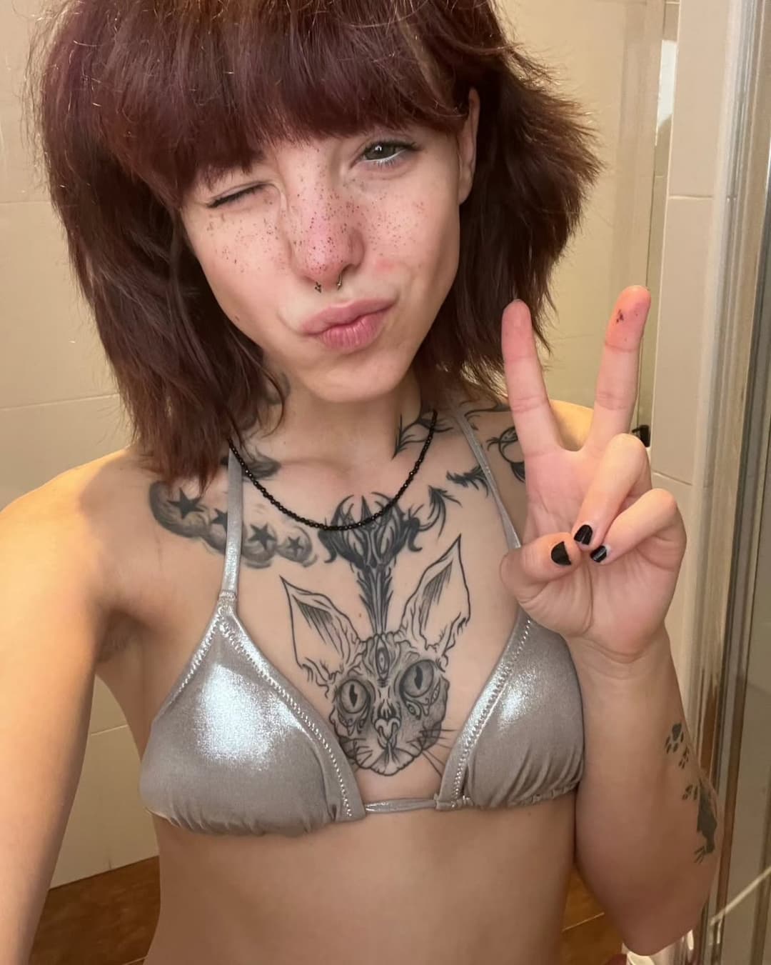 Click to view full size Cute gothic girl with small tits, pointy nipples and a dazzling smile