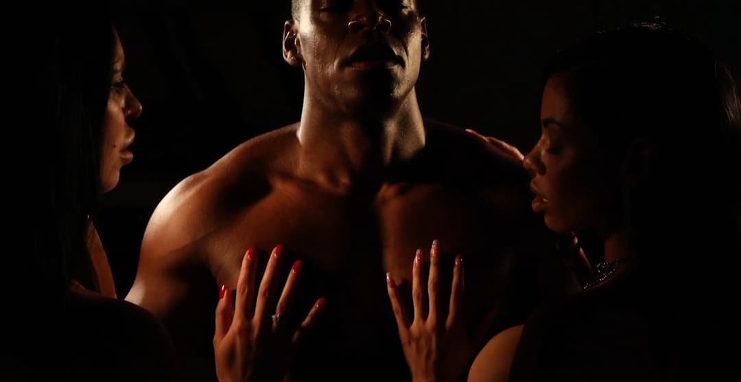 Frames of threesome between Aaron Rock, Canela Skin and Kira Queen