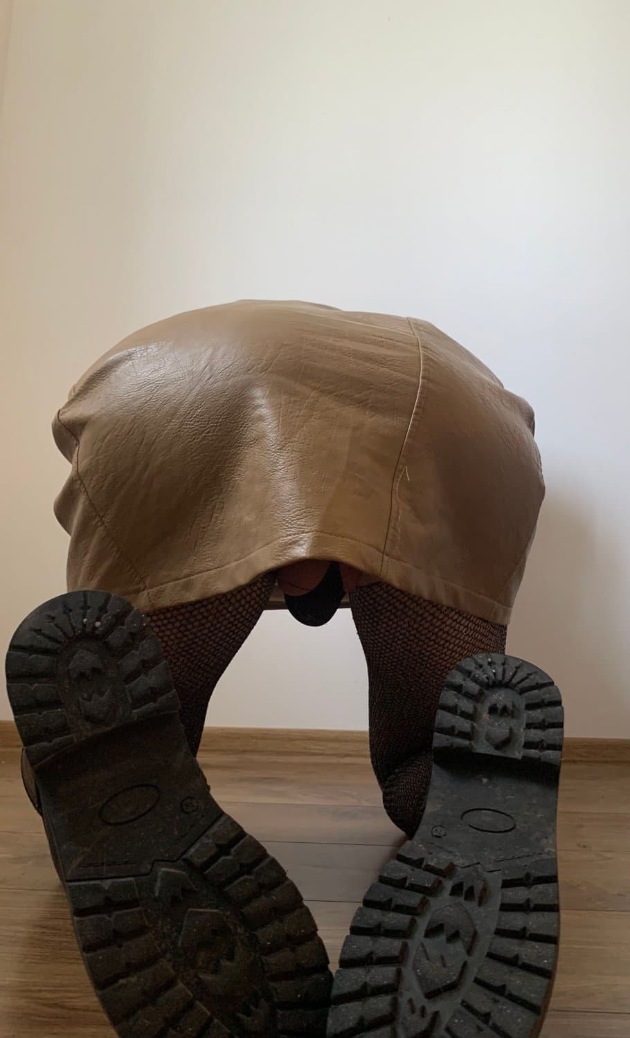 Kate Sissy Cl1412 showing her in leather skirt and fishnets