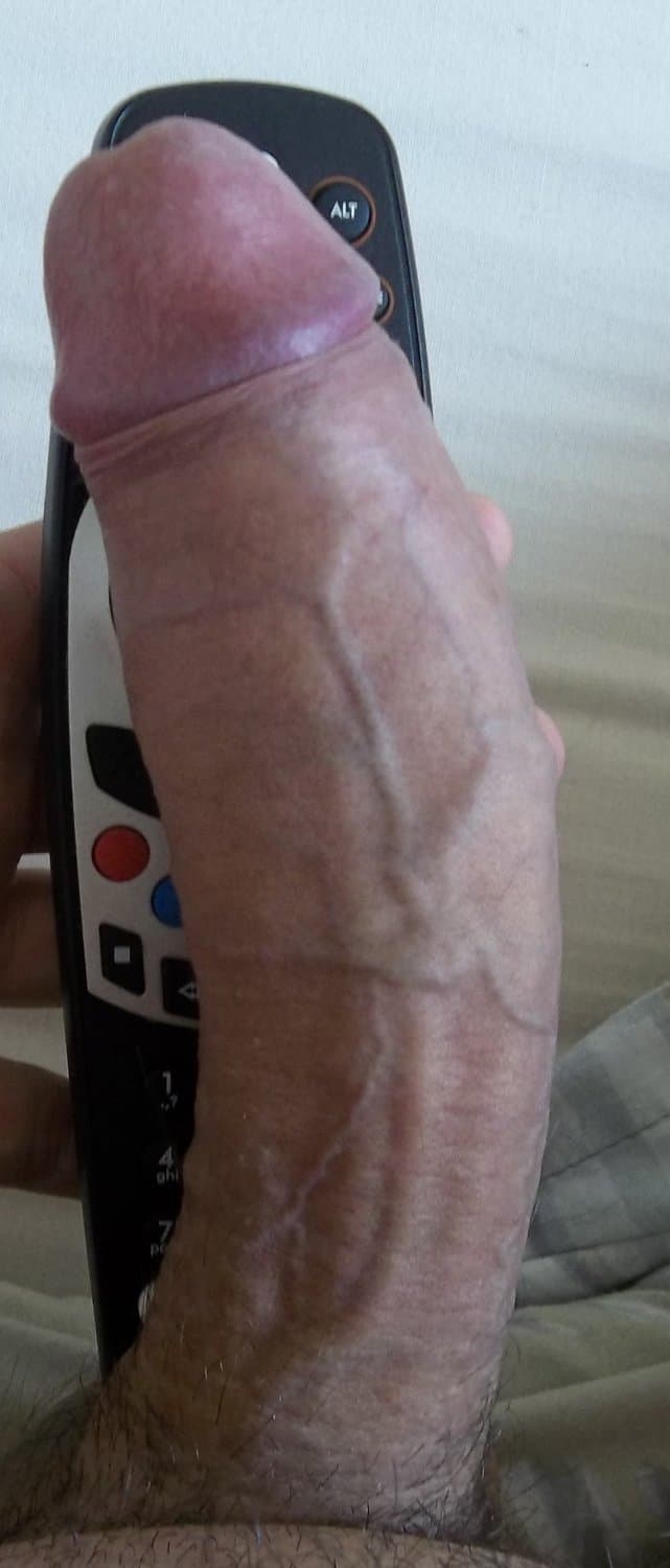 cross dresser playing with a cock pump