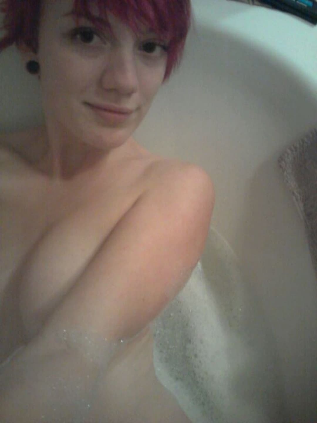 Emo redhead with perky tits teases for the camera