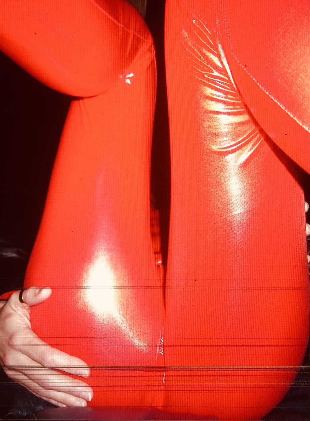 English petite biker milf in red pvc catsuit strips naked again tattoos and pierced nipples