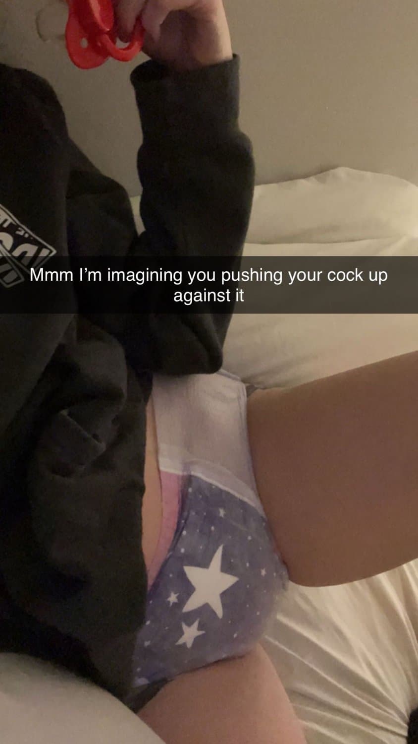 Cute tanned girl shows off her diapers and pull-ups