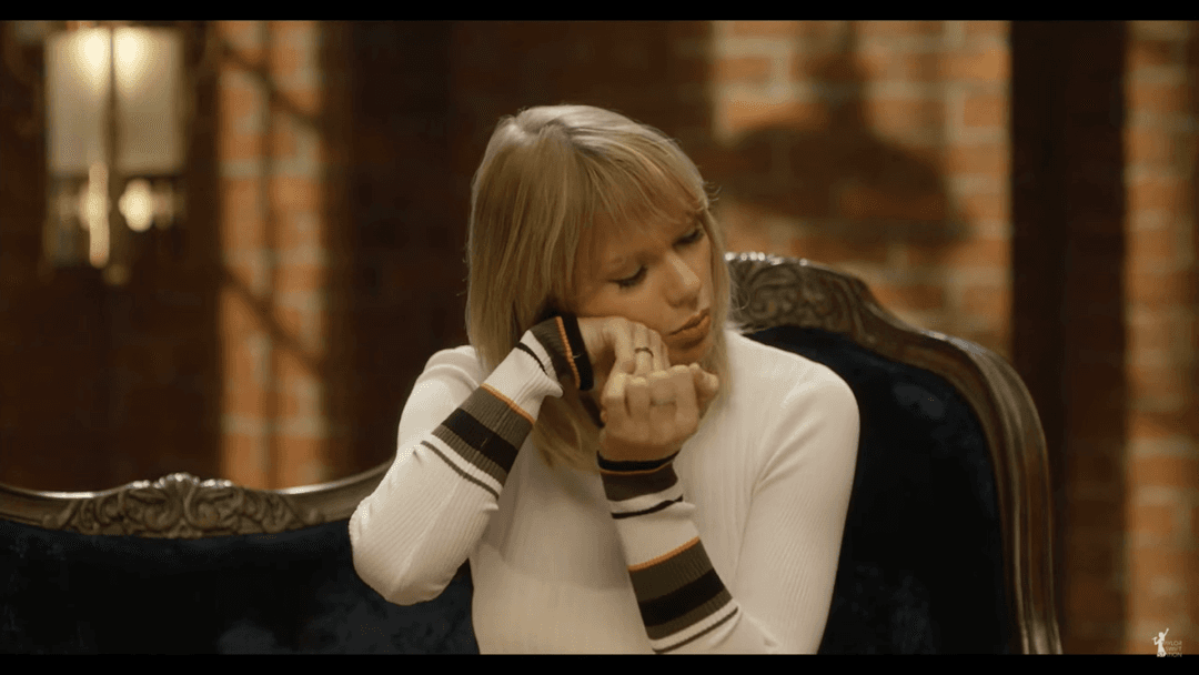 Taylor Swift tight white sweater, leather skirt, leather heels