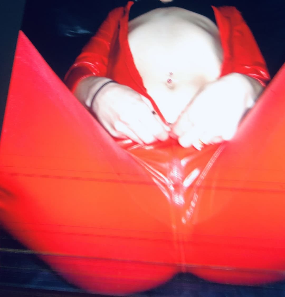 English milf in red pvc cat suit and black high heels  . uk milf in  Black lace panties pussy play