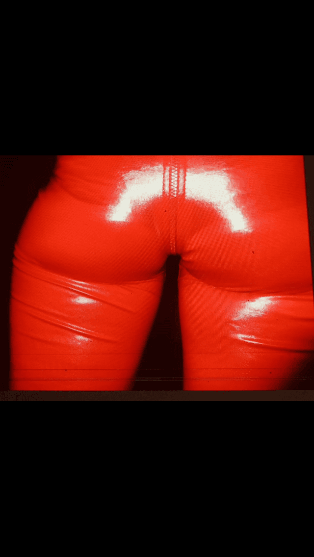 English petite biker milf in red pvc catsuit strips naked again tattoos and pierced nipples