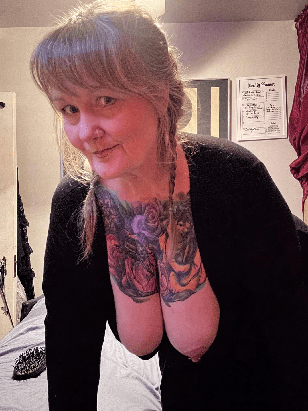 Beautiful chubby girl with tattoos and nipple piercings.