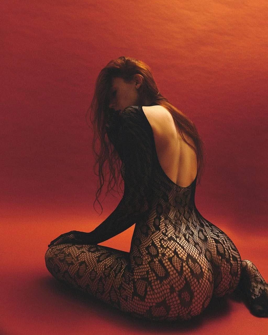 Sexy brunette in fishnets pantyhose