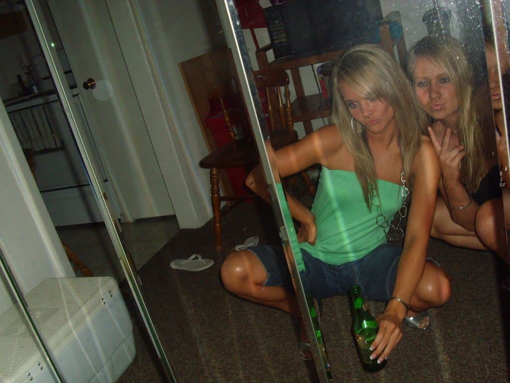 Sorority girls pre-game drink in the dorm room