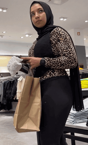 Filmed muslim hijab in the mall with tight leggings