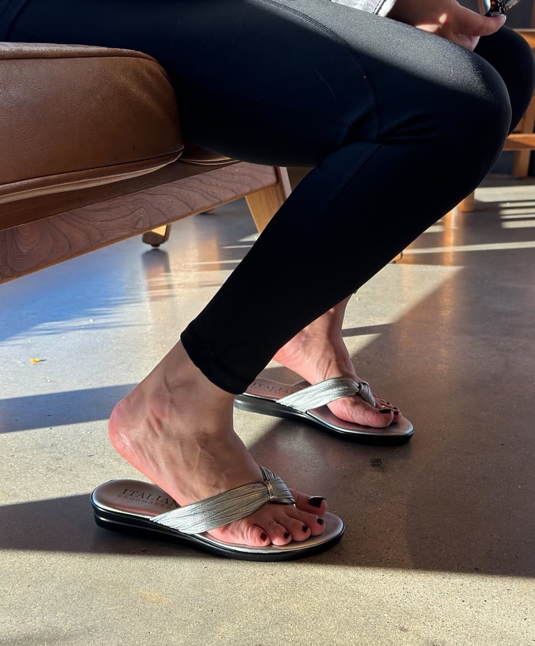 Moms friend in metallic flip flops