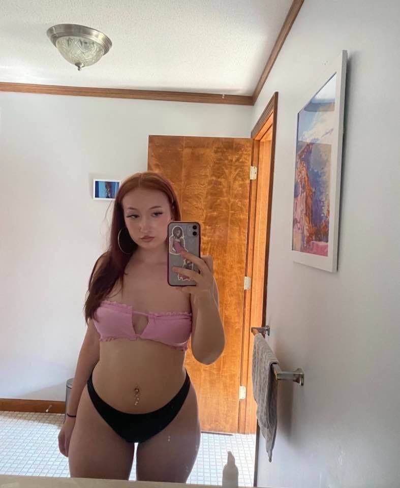 Click to view full size Slutty red head loves showing off her perfect ass