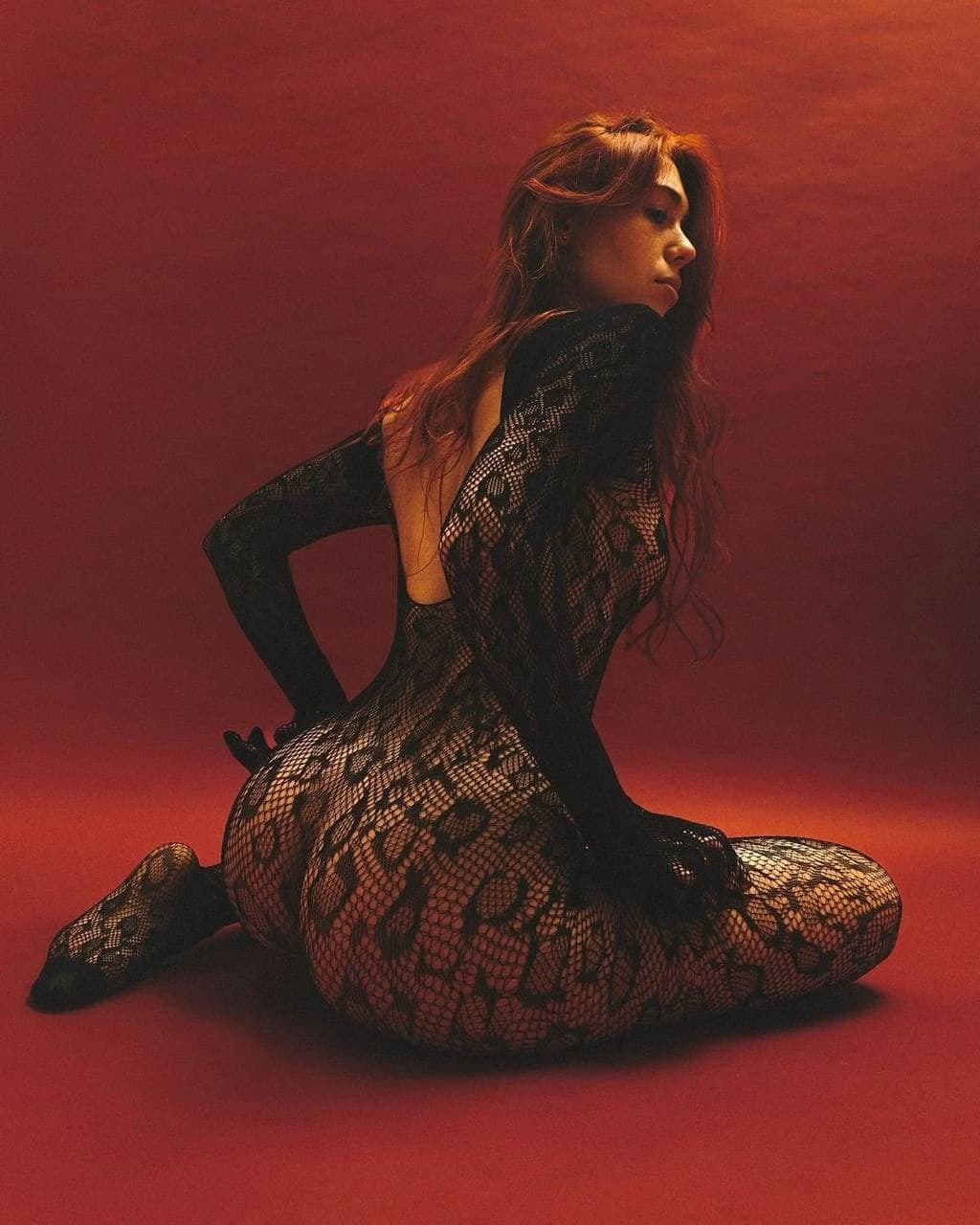 Sexy brunette in fishnets pantyhose