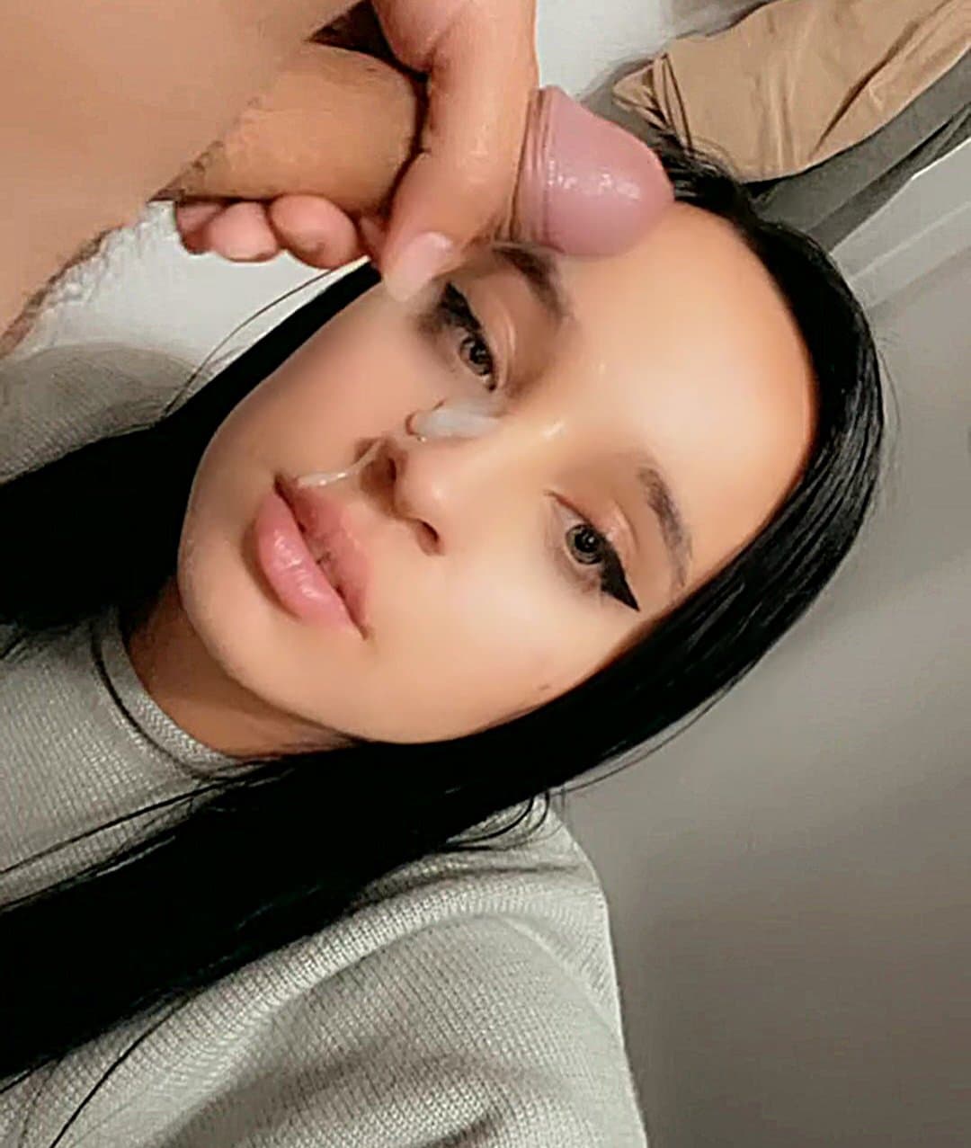 Pretty slutty girlfriend films herself getting her face squirted