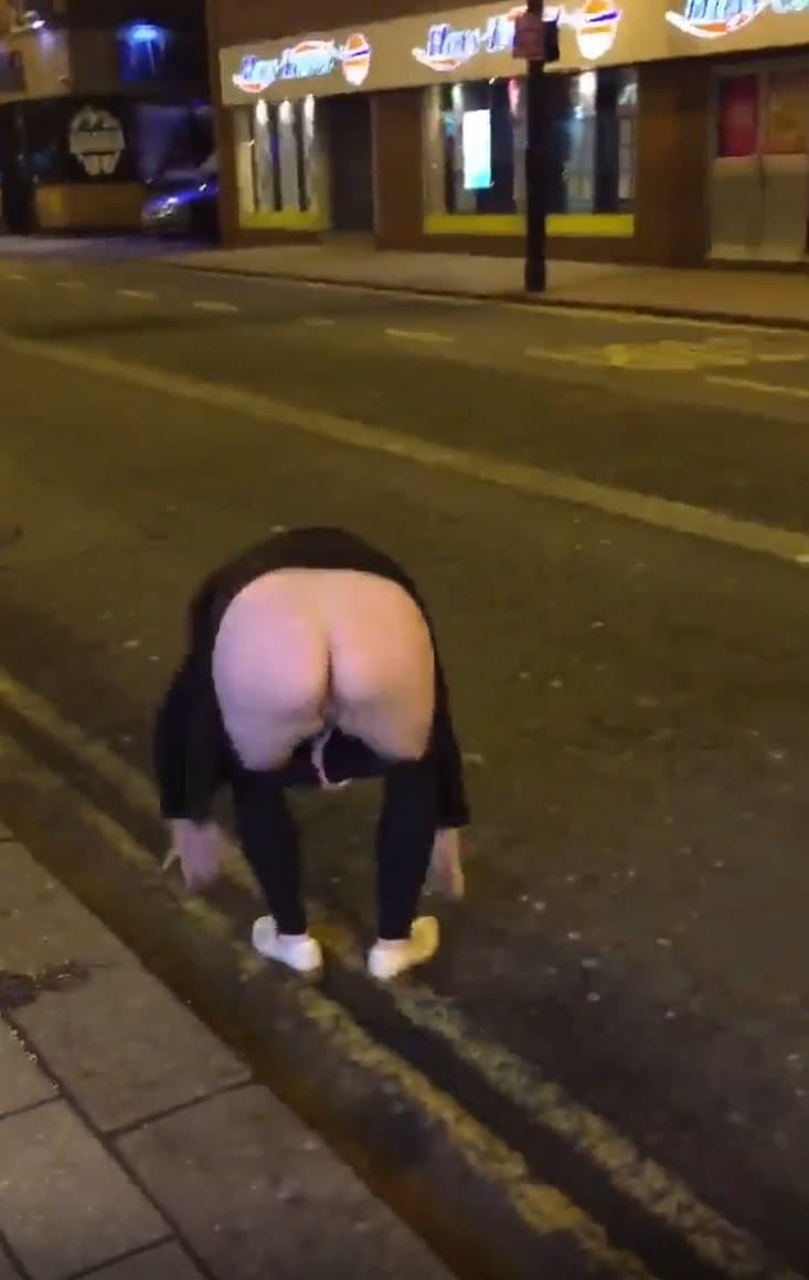 Drunk Girl Falls down while pissing in public