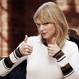 Taylor Swift tight white sweater, leather skirt, leather heels