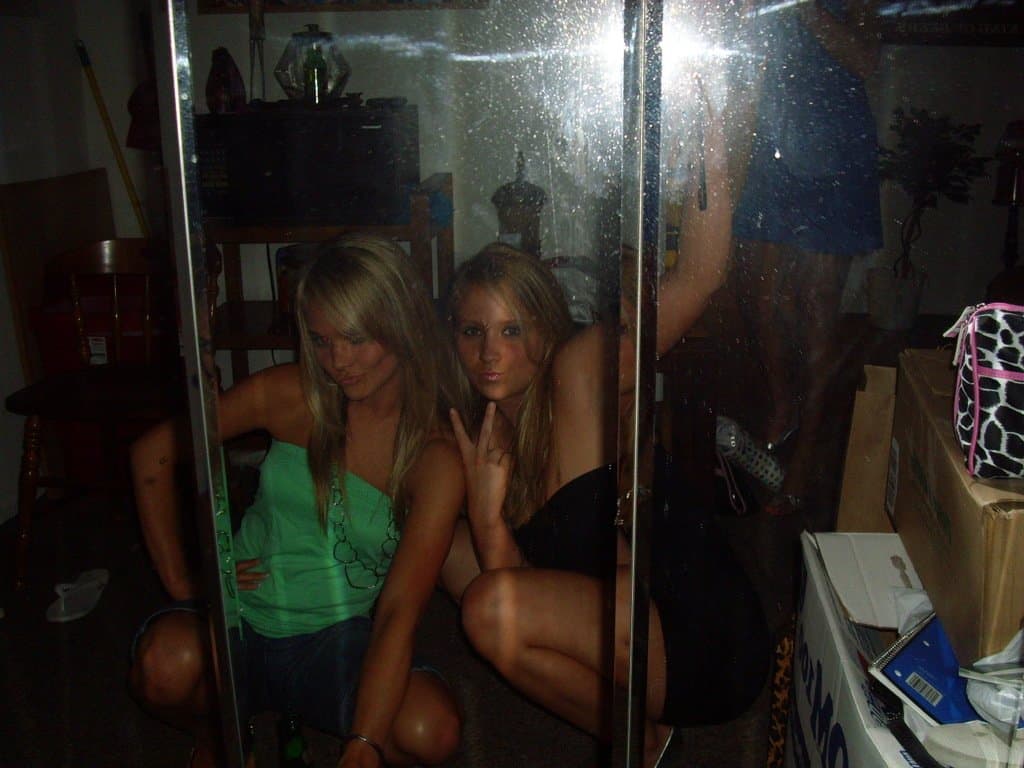 Sorority girls pre-game drink in the dorm room