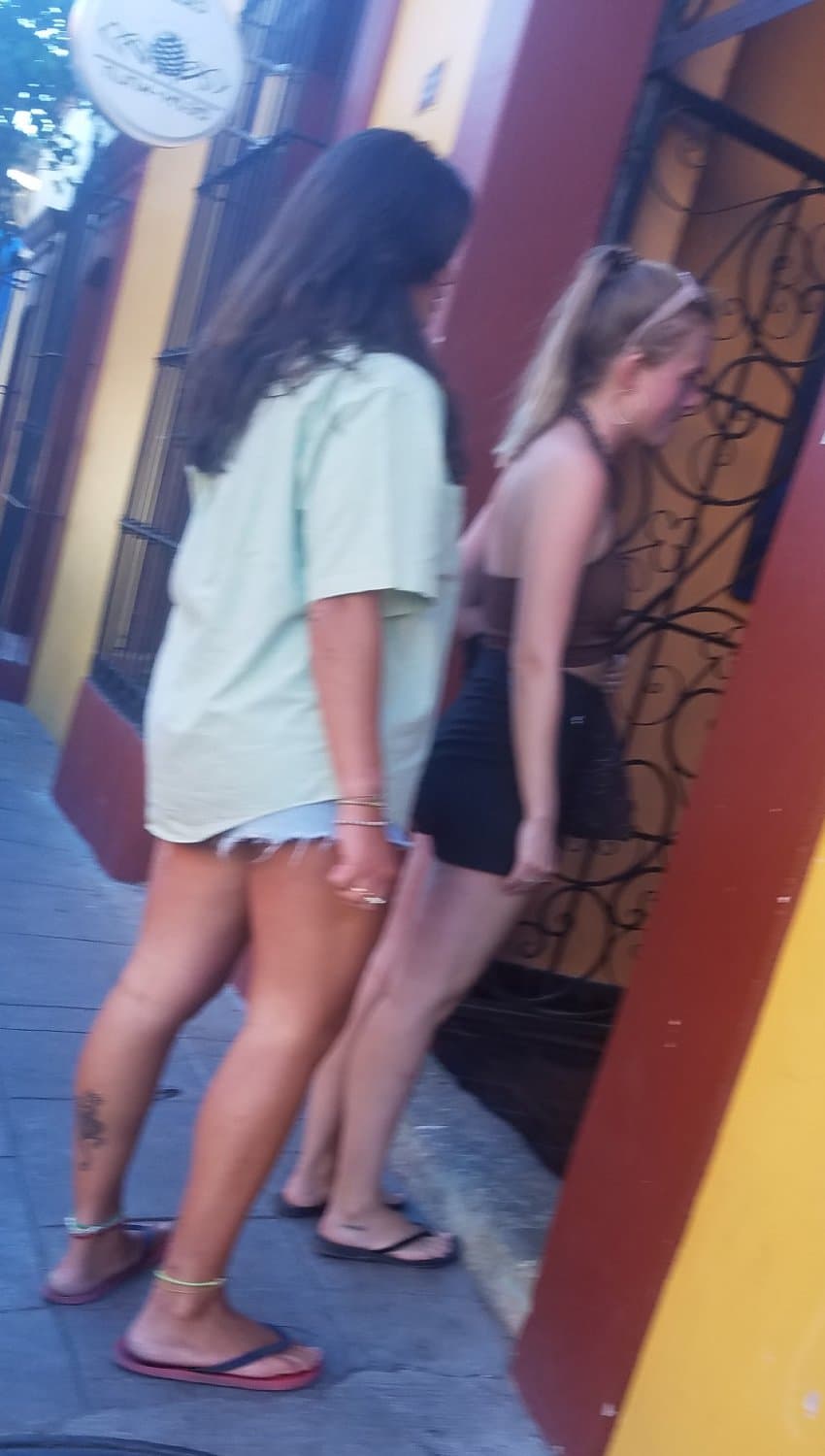 2 friends, blonde and brunette, in shorts, nice legs