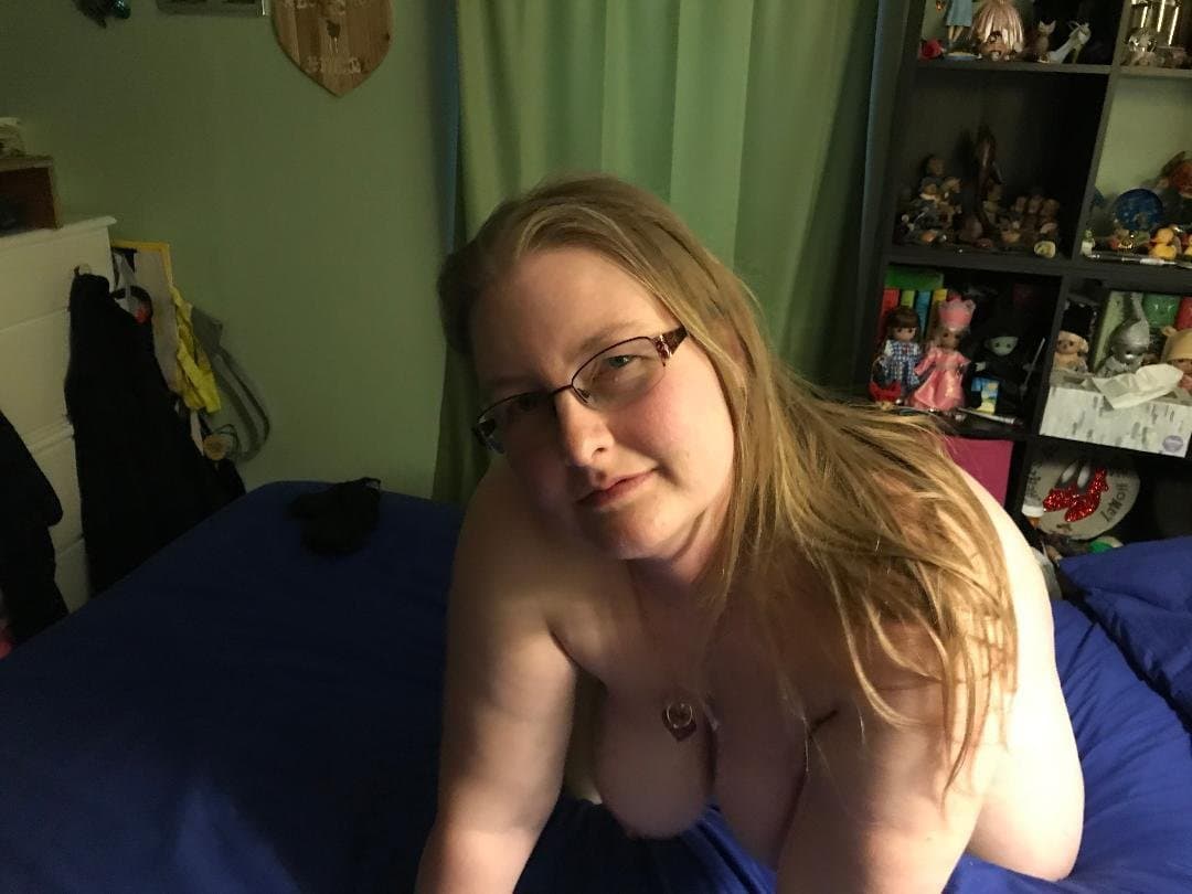 Blonde showing off her bare tits