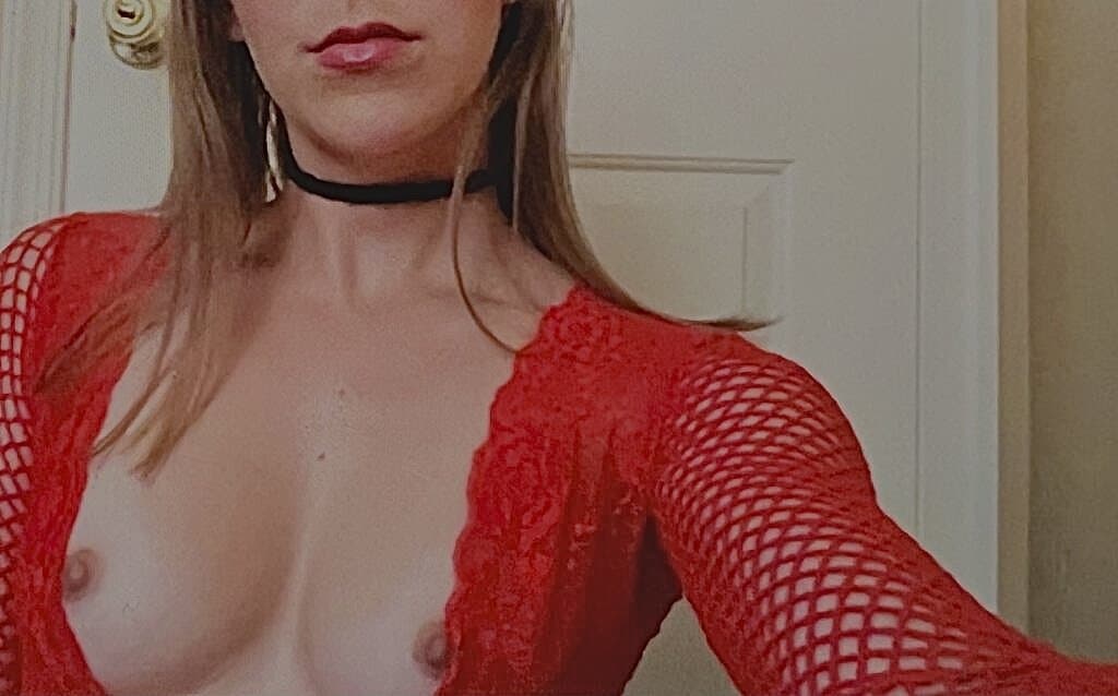 Naughty teen in red lingerie shows off her perky tits