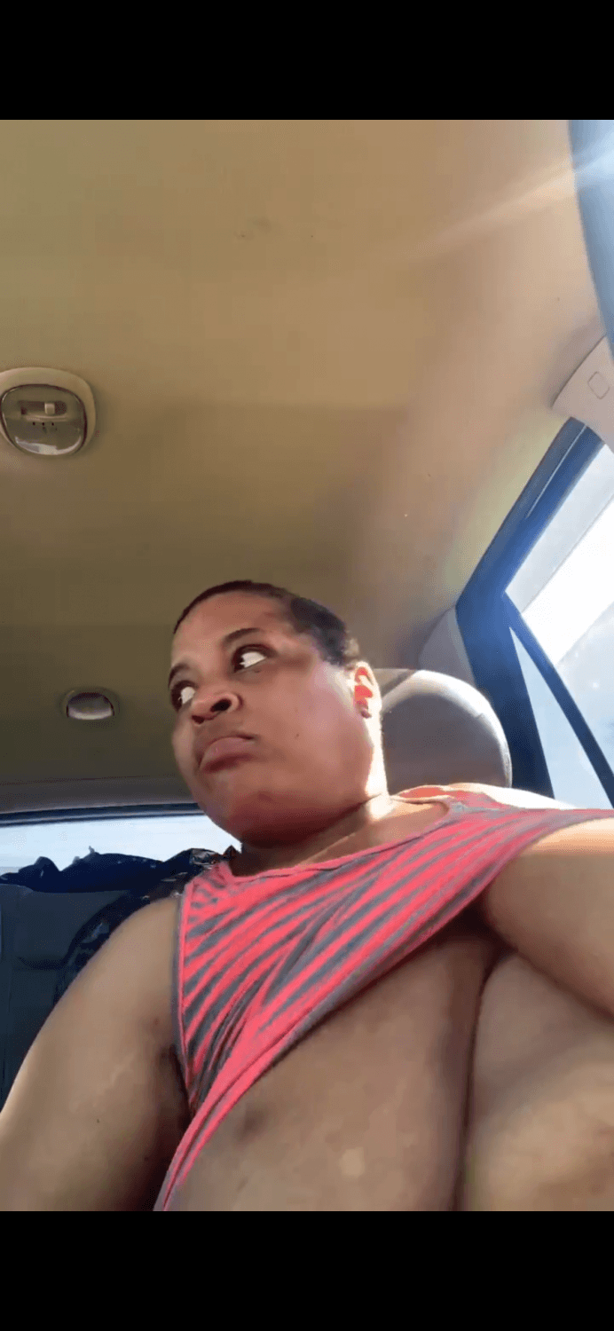 Black grandmother showing her huge saggy tits in public